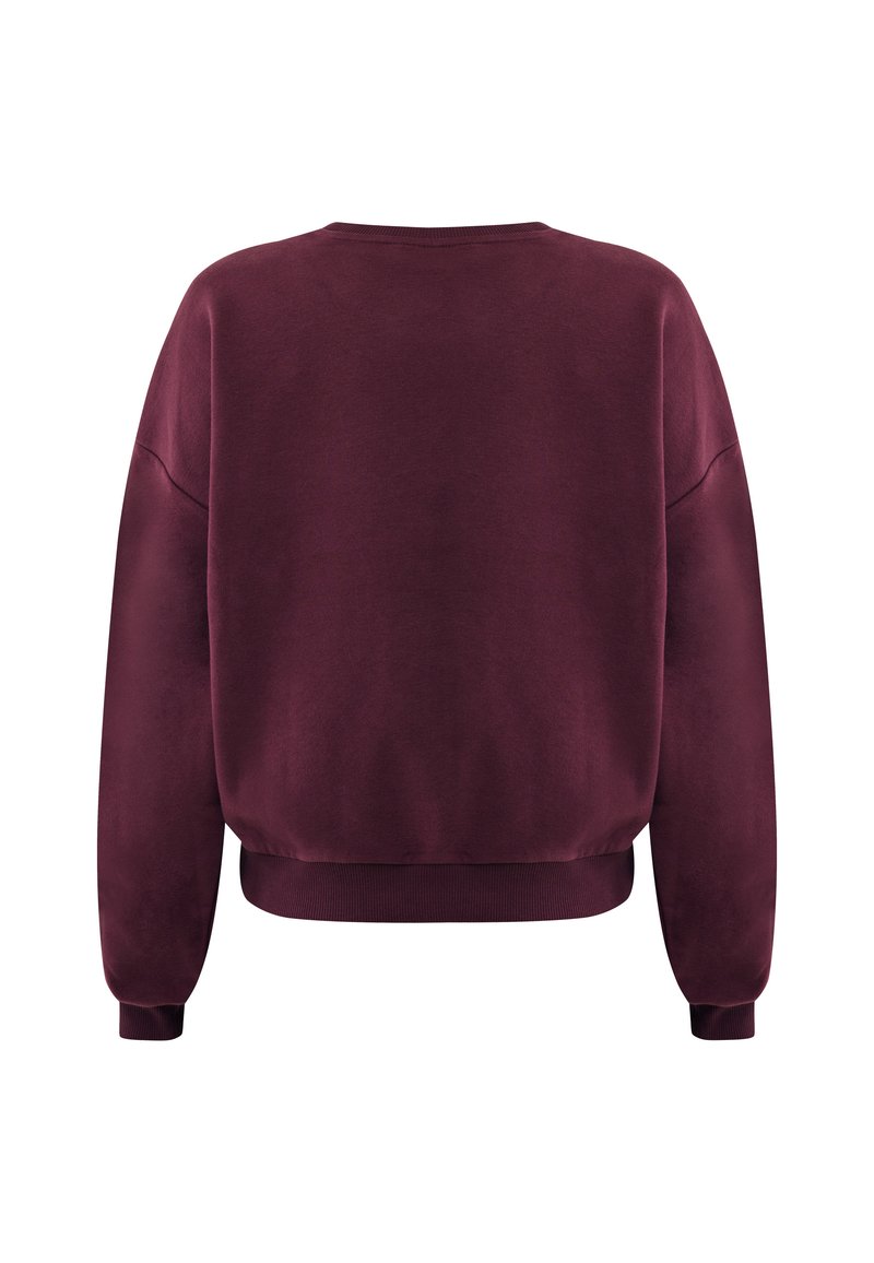 Bordeaux crewneck sweatshirt met verlaagde schouders, ribgebreide manchetten en onderrand. Zachte textuur en eenvoudig ontwerp zonder zichtbare patronen of accenten.