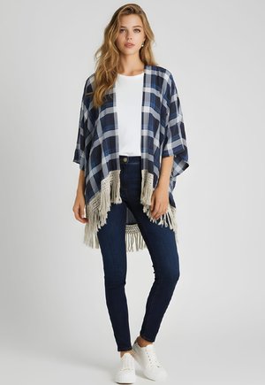 TIPO PONCHO DE CUADROS CON FLECOS - Abrigo corto - azul