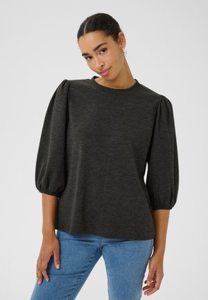Dark gray puff-sleeve top made of textured fabric, featuring a round neckline and loose fit, paired with light blue jeans.