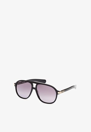 Svarta solglasögon med gradient lila linser. Plastbåge, rund form, guldaccent på skalmarna och logotypdetalj på sidan.