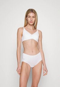 White cotton bralette and high-waisted briefs set. Soft, smooth texture with a simple design and no visible hardware.