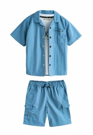 Blue short-sleeve button-up shirt over white printed T-shirt with matching blue drawstring shorts featuring side pockets and black "BAKER" text.