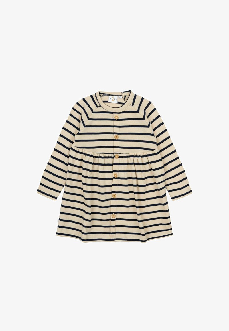 Ilgų rankovių smėlio spalvos su tamsiai mėlynomis horizontaliomis juostelėmis suknelė, turi apvalų iškirpimą, mygtukų užsegimą ir susirinkusį liemenį, kuris suteikia platų siluetą.