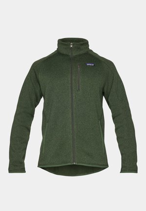 Chaqueta de forro polar verde con cremallera, que presenta un alto cuello, bolsillos laterales y un bolsillo en el pecho con cremallera. Fabricada con un tejido texturizado y cálido.