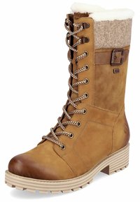 Botas altas de ante marrón con un forro blanco de peluche, un cuello de tejido gris texturizado y detalles de cuero marrón. Presentan herrajes metálicos y una suela gruesa.
