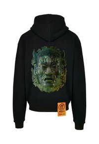 Haut à capuche noir avec un grand graphique détaillé de masque vert et noir au dos, accompagné d'une étiquette affichant la marque et le poids du tissu.