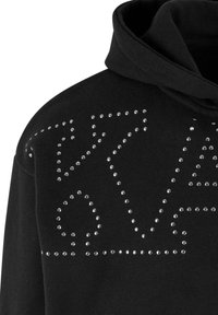 Black hooded sweatshirt featuring silver studs arranged in geometric patterns along the front, creating a textured appearance.