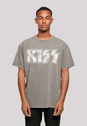 Gray oversized t-shirt featuring a prominent white "KISS" logo in a bold, distressed font. Made from soft cotton with a relaxed fit.