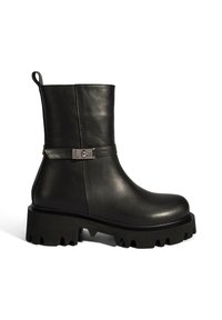 Black leather ankle boot with a chunky platform sole, a sleek upper, and a decorative metal buckle detail on the side.