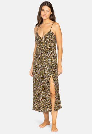 Black maxi dress with floral print, featuring thin adjustable straps and a thigh-high slit on one side. Made from lightweight fabric.