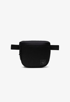 Crna platnena pojasna torba s glatkom teksturom, zatvaranjem na patentni zatvarač i malim logotipom na prednjoj strani. Ima podesive bočne trake.