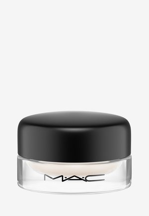 MAC cream in a clear glass jar with a black rounded lid. The texture appears smooth and the cream is a light, neutral color.