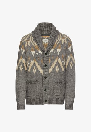 Grijze gebreide cardigan met een sjawlkragen, voorzien van geometrische patronen in crème en goud, zes zwarte knopen en twee voorzakken.