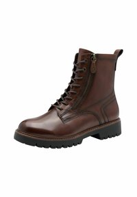Bottes chelsea en cuir marron avec un orteil rond, un laçage à l'avant, une fermeture éclair sur le côté et une semelle en caoutchouc texturée pour une bonne adhérence. Présente des coutures discrètes.