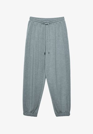 Grey sweatpants made of soft material, featuring an elastic waistband with drawstring, tapered cuffs, and side seam pockets.