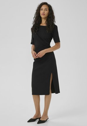 Black, ankle-length dress with a square neckline, short sleeves, side slit, and wrap design; made of smooth, lightweight fabric.