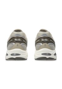 Gray mesh sneakers with a rounded shape, metallic accents, and visible air cushioning in the heel. Durable rubber outsole with textured pattern.