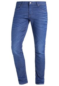 Blå denimjeans med slim fit, utrustade med sömdekor, femficksdesign och en klassisk dragkedja med knappknäppning.