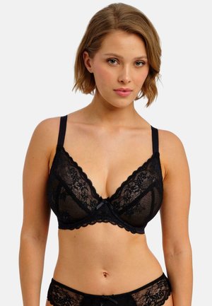 Zwarte kanten beha met een driehoekige vorm, delicate bloemmotieven, verstelbare bandjes en een satijnen strikaccent in het midden.