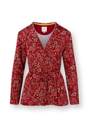 Red floral wrap jacket with long sleeves, tie waist, and a textured design. Features a V-neckline and a vibrant, detailed pattern.