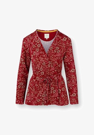 Red floral wrap jacket with long sleeves, tie waist, and a textured design. Features a V-neckline and a vibrant, detailed pattern.