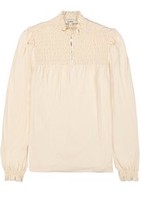 Crème-kleurige blouse met lange mouwen, gedetailleerde smock op de borst, ruches bij de kraag en knoopsluiting, en voorzien van elastische manchetten voor een geplooid effect.