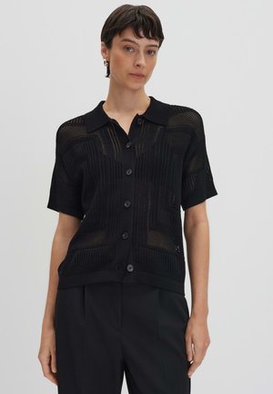 Black knit short-sleeve shirt with a button-down design, featuring a textured pattern and a spread collar.