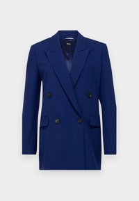 Dubbelknäppt marinblå kavaj med spetsiga slag, svarta knappar, två framfickor och en slät yta.