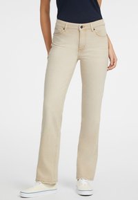 Beige džíny se rovnými nohavicemi vyrobené z odolného denimu, s vysokým pasem, pěti kapsami a klasickým zapínáním na knoflík.