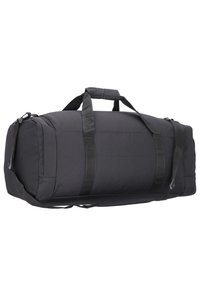 Black duffel bag made of durable fabric, featuring dual top handles and an adjustable shoulder strap, with a spacious, rounded design.