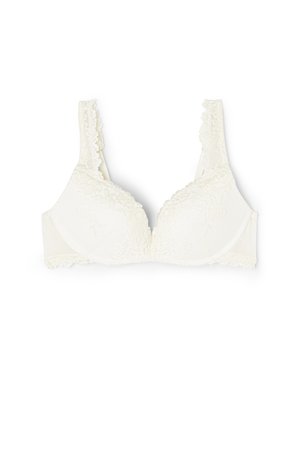 Soutien-gorge en dentelle blanche avec bonnets rembourrés, bords festonnés et détails en dentelle florale sur les bretelles et le bandeau.