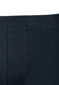 Mørkeblå bomulds underbukser med blød tekstur, elastisk taljebånd og dobbelte sømme for holdbarhed.