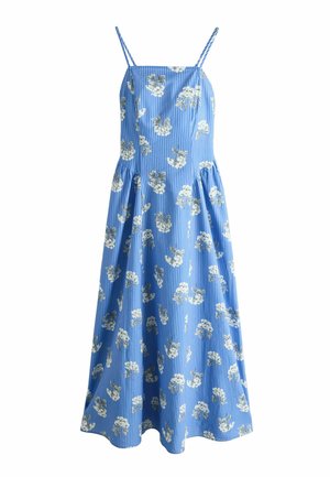 Blue sleeveless sundress with thin straps, white floral print, vertical stripes, fitted bodice, and flared midi skirt.