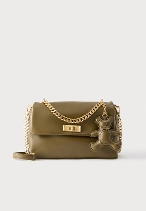 Olive green faux leather handbag with a gold chain strap, featuring a magnetic closure and a teddy bear charm detail. Smooth texture.