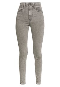 Jeans skinny de mezclilla gris de cintura alta con una textura suave, diseño de cinco bolsillos y un acabado ligeramente desgastado.