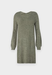 Robe en tricot vert olive avec un décolleté en V et un détail croisé dans le dos. Elle présente des manches longues légèrement bouffantes et un ourlet côtelé. Texture douce.