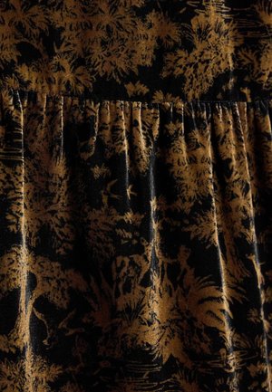 Black fabric with a gold floral pattern, featuring gathered pleats along the waistline. Soft texture with a slight sheen.