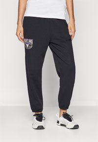 Under Armour Jogginghose - black