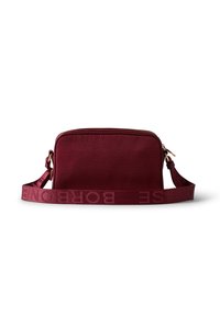 Burgundy crossbody bag with a textured finish, zip closure, and a wide strap featuring embossed logo detailing. Rectangular shape.