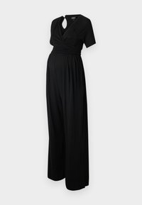 Combinaison de maternité noire avec un design enveloppant, manches courtes, détail du col en forme de trou de serrure et jambes larges amples en tissu doux et extensible.