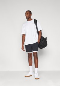 Under Armour Potiskana majica - white/racer red