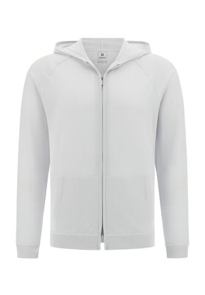 Sudadera con cremallera de color gris claro, confeccionada en una tela suave, que presenta una capucha, bolsillos frontales y puños de canalé. Textura suave con un diseño sencillo.