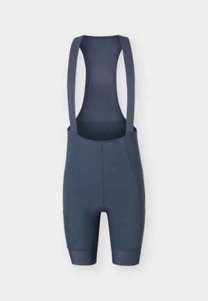 Tumši zili riteņbraukšanas bikses ar sietveida aizmugures paneli un plašām plecu lencēm, paredzētas ciešai un atbalstošai piekļuvei.