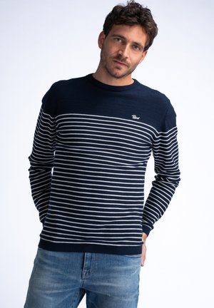 Navy blue and gray striped sweater with long sleeves and a crew neck; features a small logo on the chest and ribbed cuffs and hem.
