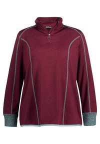 Bordeaux pullover with half-zip collar, contrasting gray stitching, and textured sleeves. Made of soft fabric with a relaxed fit.