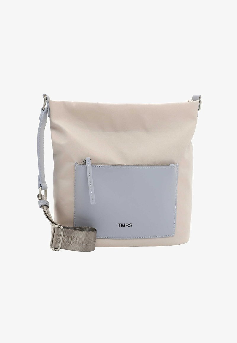Soft, beige fabric bag with a rectangular gray leather front pocket. Features adjustable gray strap and silver hardware. Logo printed in black.