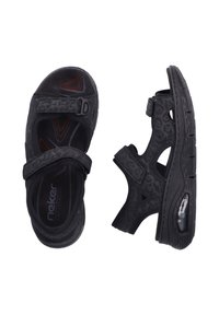 Sandales noires avec un motif texturé, dotées de deux fermetures à sangle ajustables et d'une semelle rembourrée avec un détail de coussin d'air.