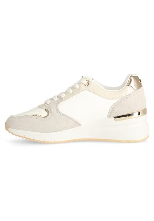 Sport sneaker with a beige suede and white synthetic upper, metallic gold accents on the heel, and textured sole for grip.