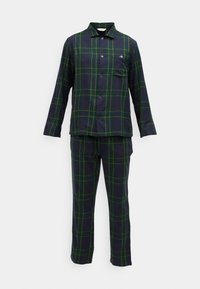 Camicia a maniche lunghe a quadri verde scuro e blu navy con pantaloni abbinati, caratterizzata da linee gialle e una tasca sul petto.