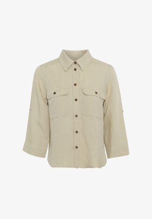 Beige Hemd mit Knopfverschluss aus strukturiertem Stoff. Verfügt über zwei Brusttaschen, einen Kragen und braune Knopfakzente. Dreiviertelärmel.